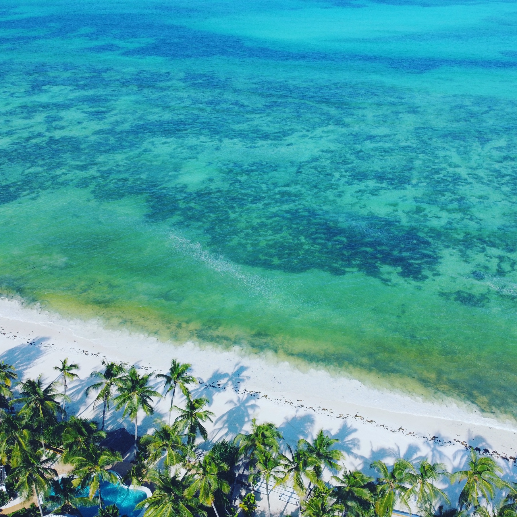 Villa Kidosho infinity pool above the beach, aerial view