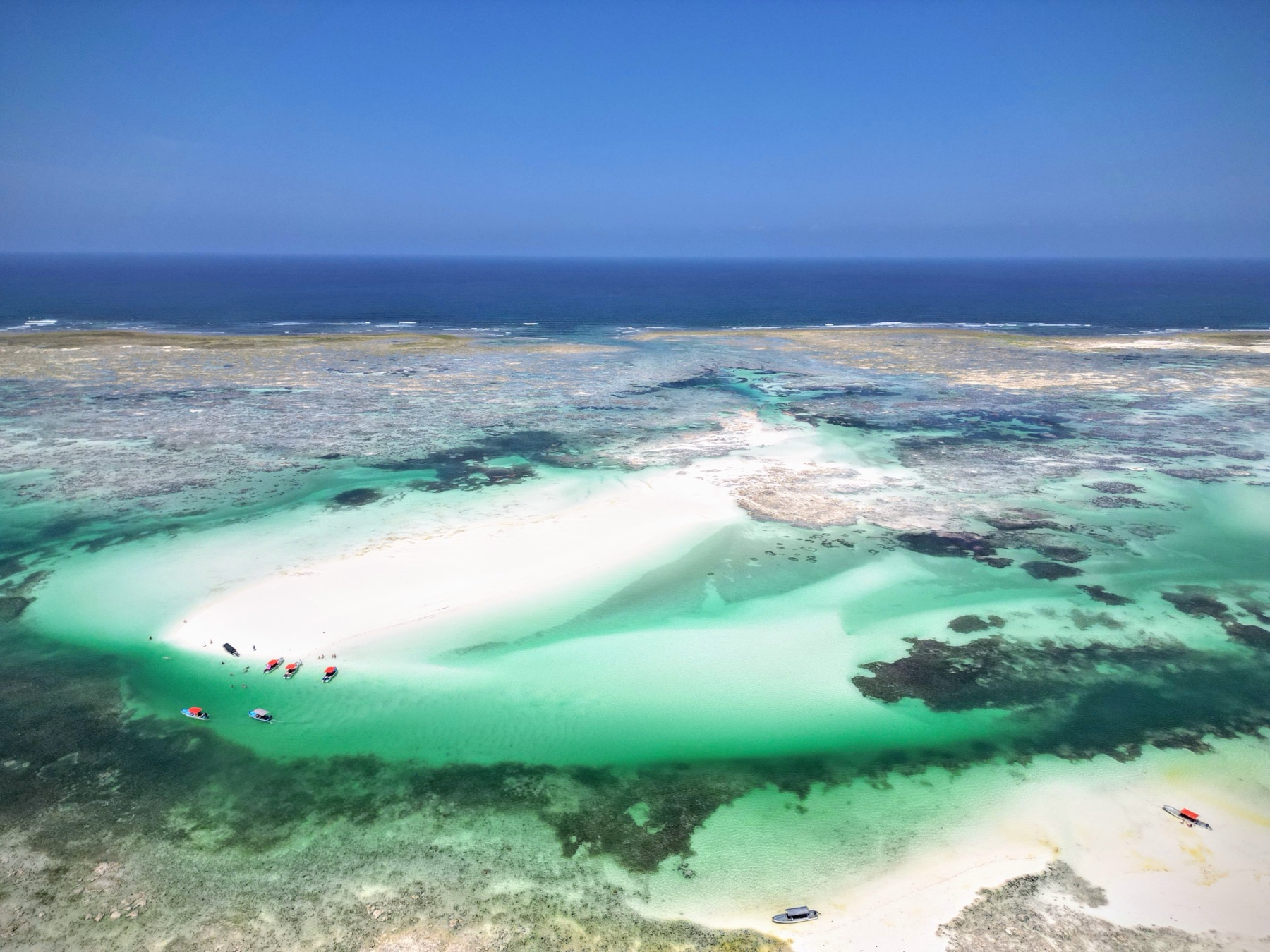 Mchanga sandbank surrounded by turquoise water, aerial