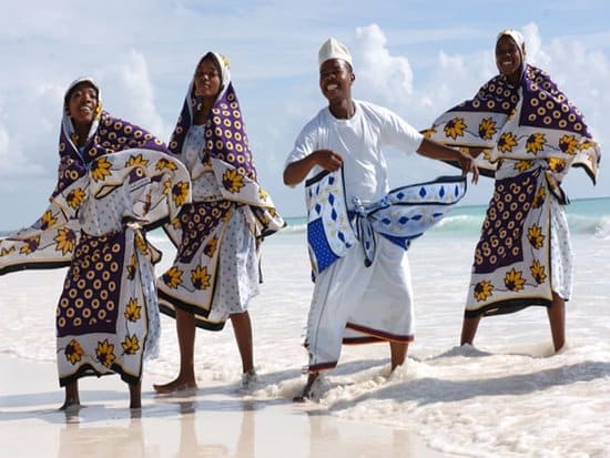 people dancing at the beach