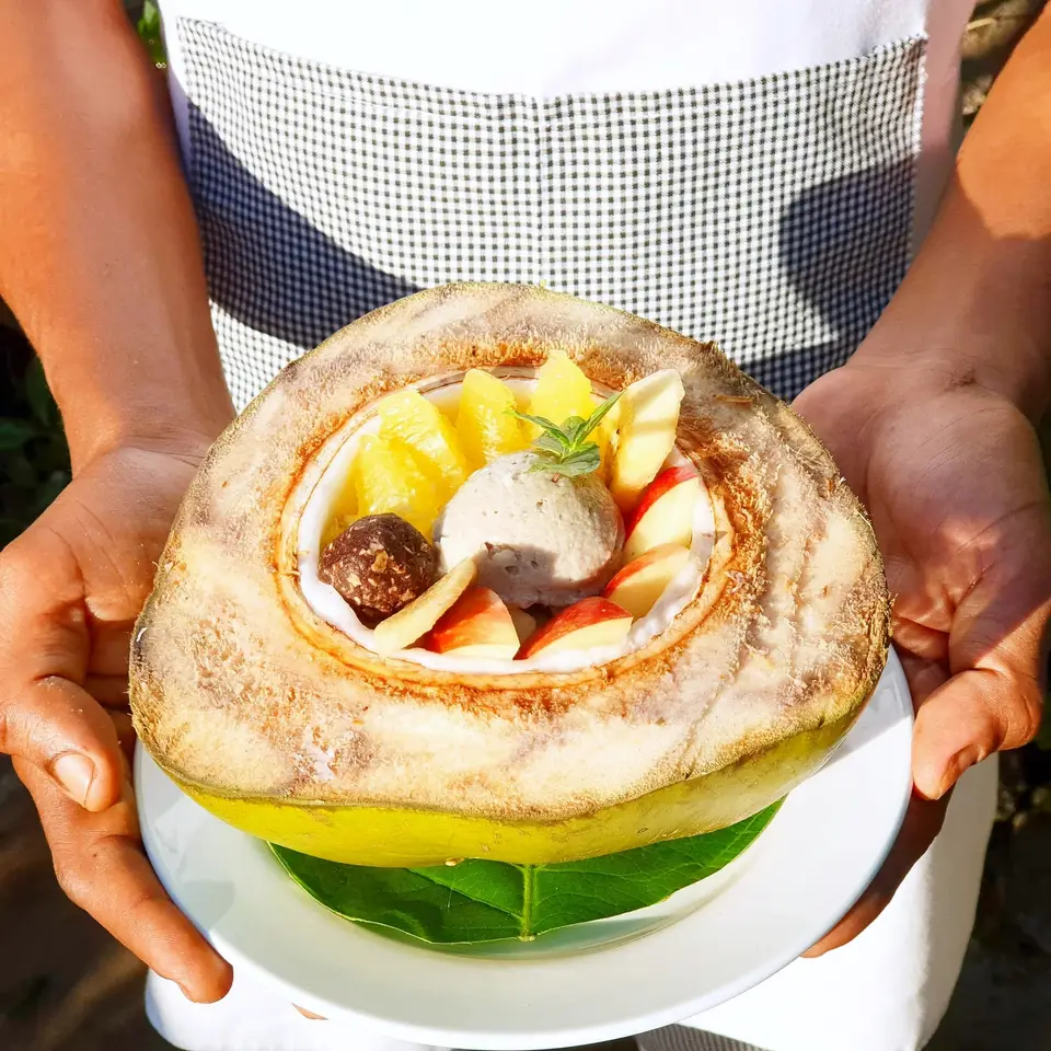 Coconut Special Dessert served in a young coconut at Zatiny Restaurant, Boutique Hotel Matlai Zanzibar.