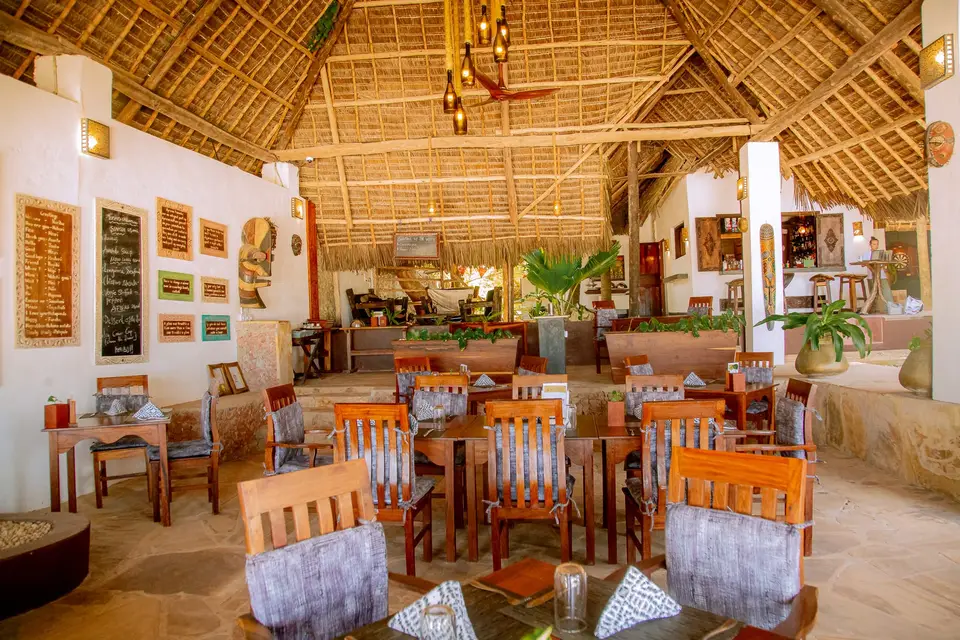 Zatiny Restaurant at Boutique Hotel Matlai Zanzibar in the early morning light with a calm beach atmosphere.