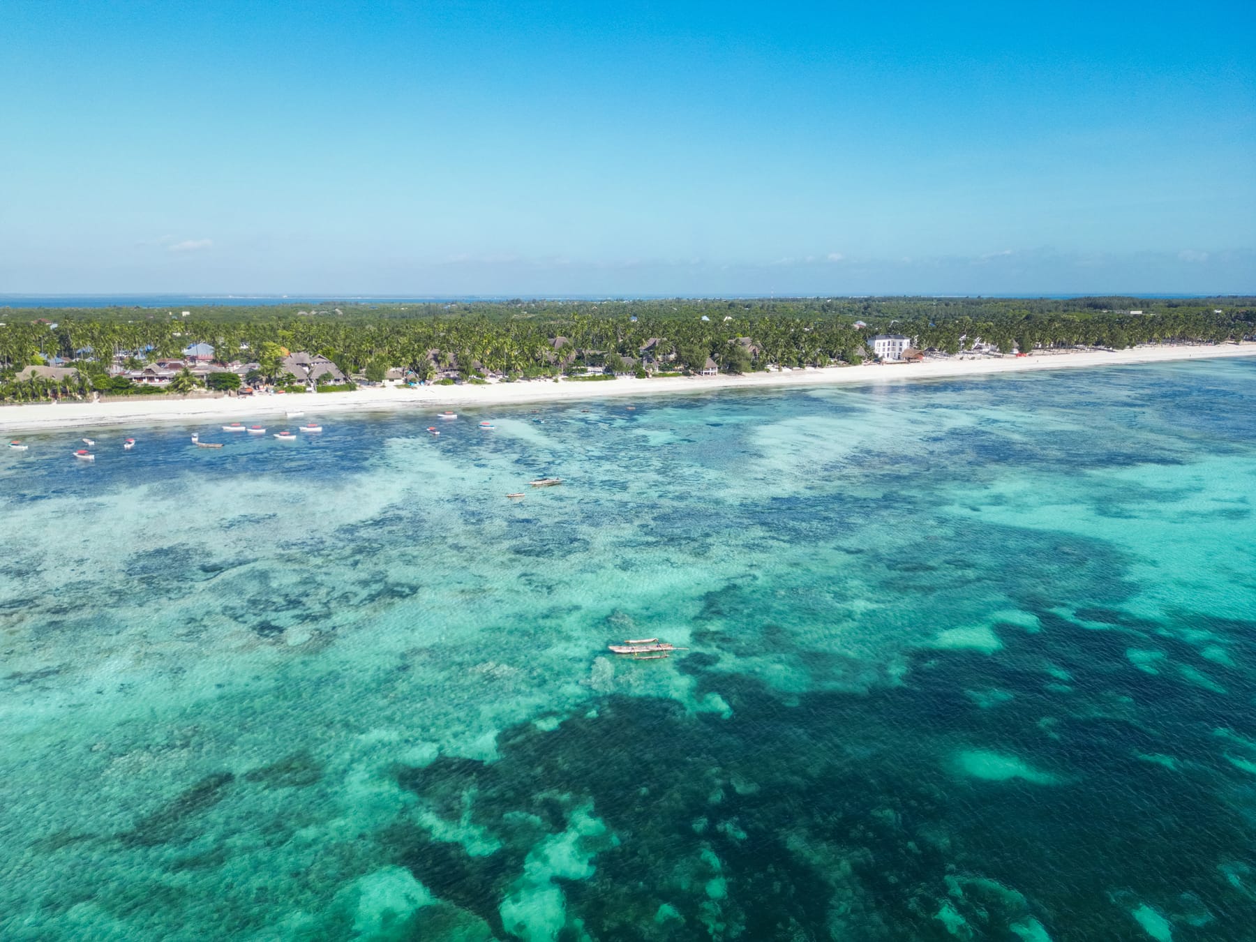 Aerial view of Zanzibar's east coast with turquoise water and white sand near Michamvi