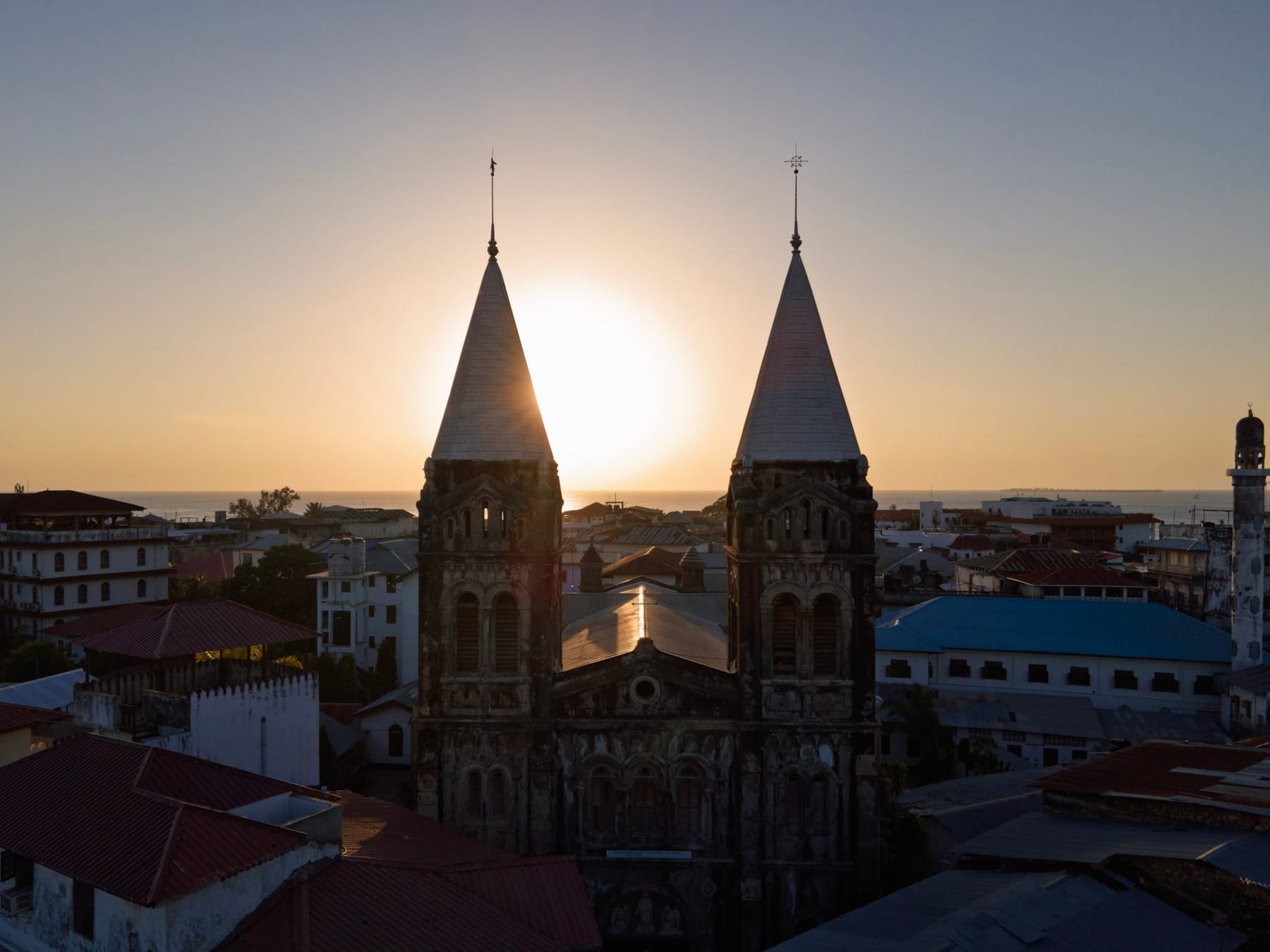 Zanzibar Town from the air in evening light, the side of the island where the AFCON 2027 stadiums stand